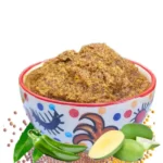 Moumachi Homemade Aam Kasundi raw green mango mustard pickle in a ceramic bowl with fresh mangoes and mustard seeds
