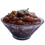 Moumachi Chalta Tok Jhal Mishti chutney in a decorative glass bowl